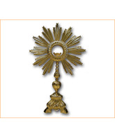 Custodia barroca de bronce decorada con motivos eucarísticos