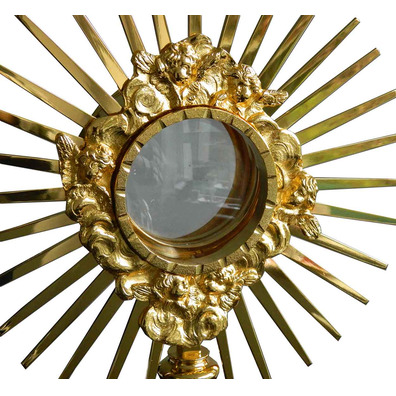 Custodia en metal dorado con rayos y Cruz