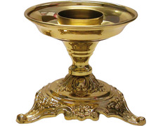 Candelero de mesa con motivos litúrgicos en la base