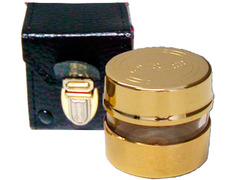 Crismera de metal dorado con estuche de piel
