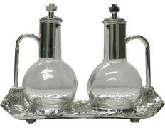 Vinajeras de cristal y metal plateado